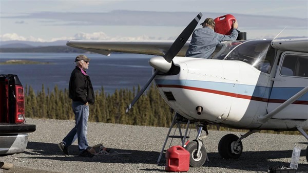 Photography of Evergreen Lodge's owner, Dennis Oakland, fueling his Cessna 175 for pilot Galen Gault's flight with AOPA Media's Senior VP Tom Haines.

Lake Louise Airport (Z55)
Glennallen, AK USA