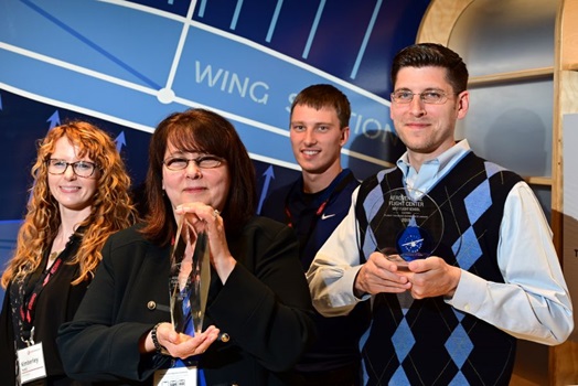 George and Debra Allen of AeroVenture, with other members of their team, are recognized as the best school int he U.S. during the 2019 AOPA Flight Training Experience Awards at the Wings Over the Rockies museum in Denver, October 16, 2019. Photo by David Tulis.